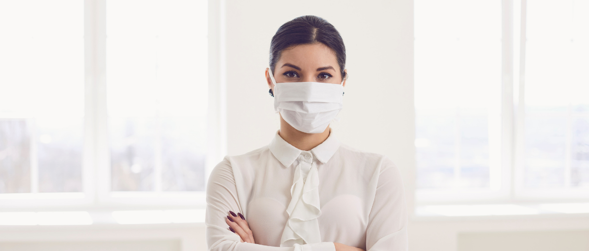 Industry professional working in the office wearing mask