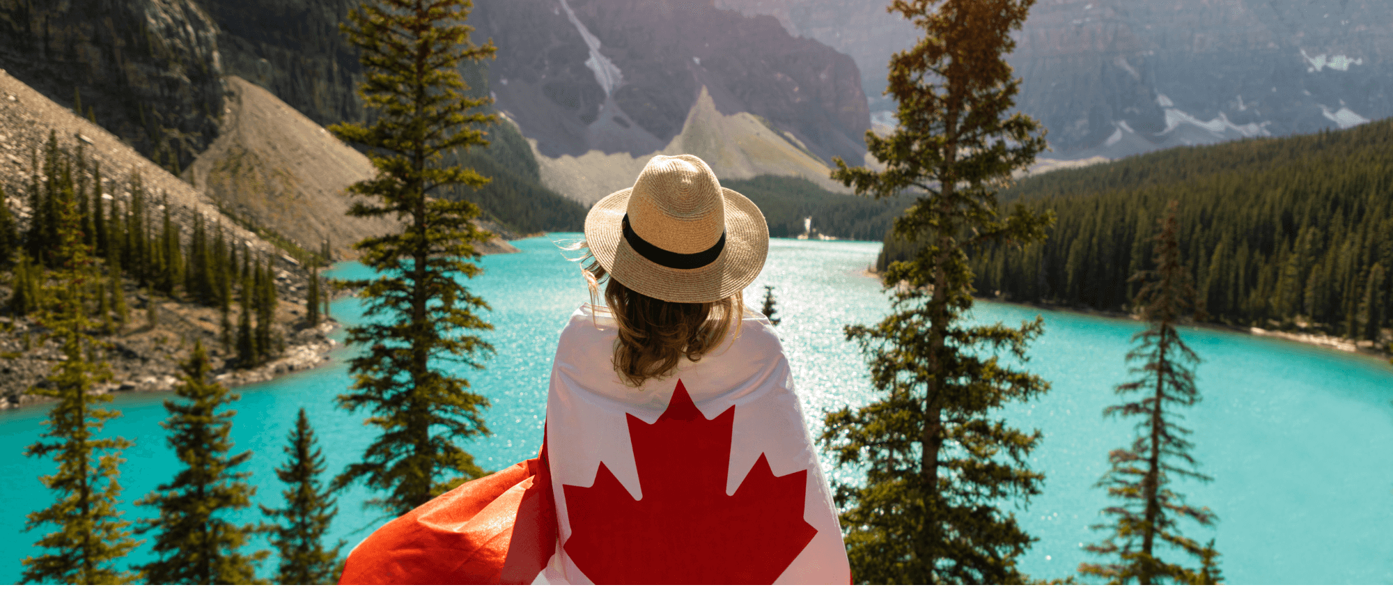 woman in mountains with canadian flag