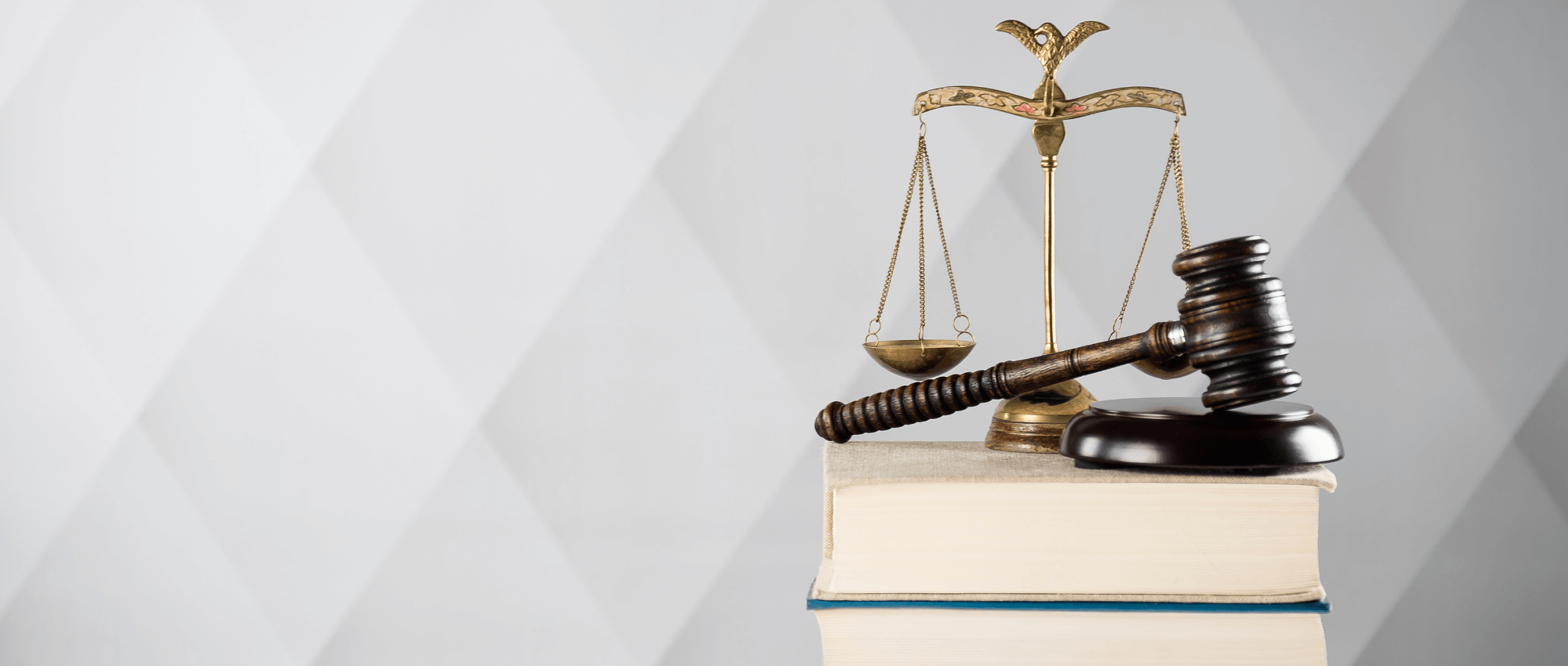 justice scales and gavel on books