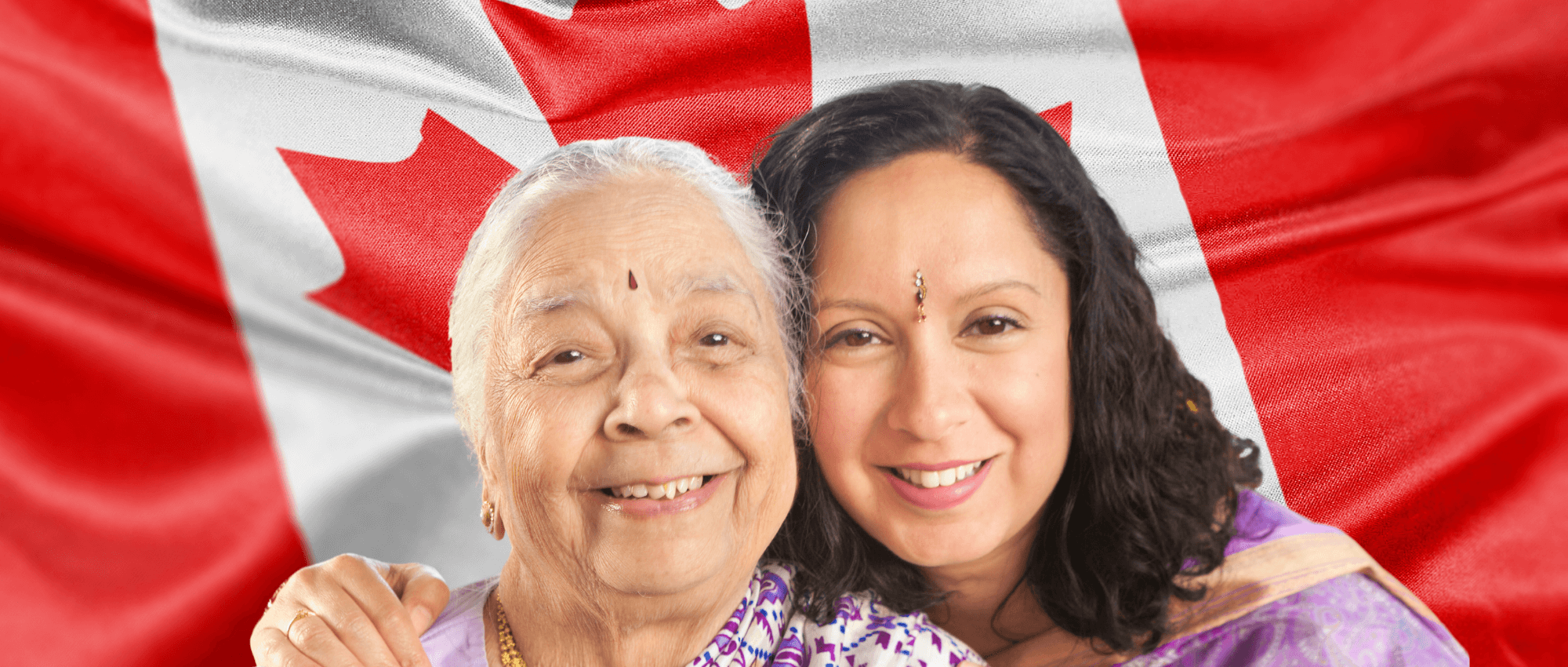 happy women in front of Canadian flag