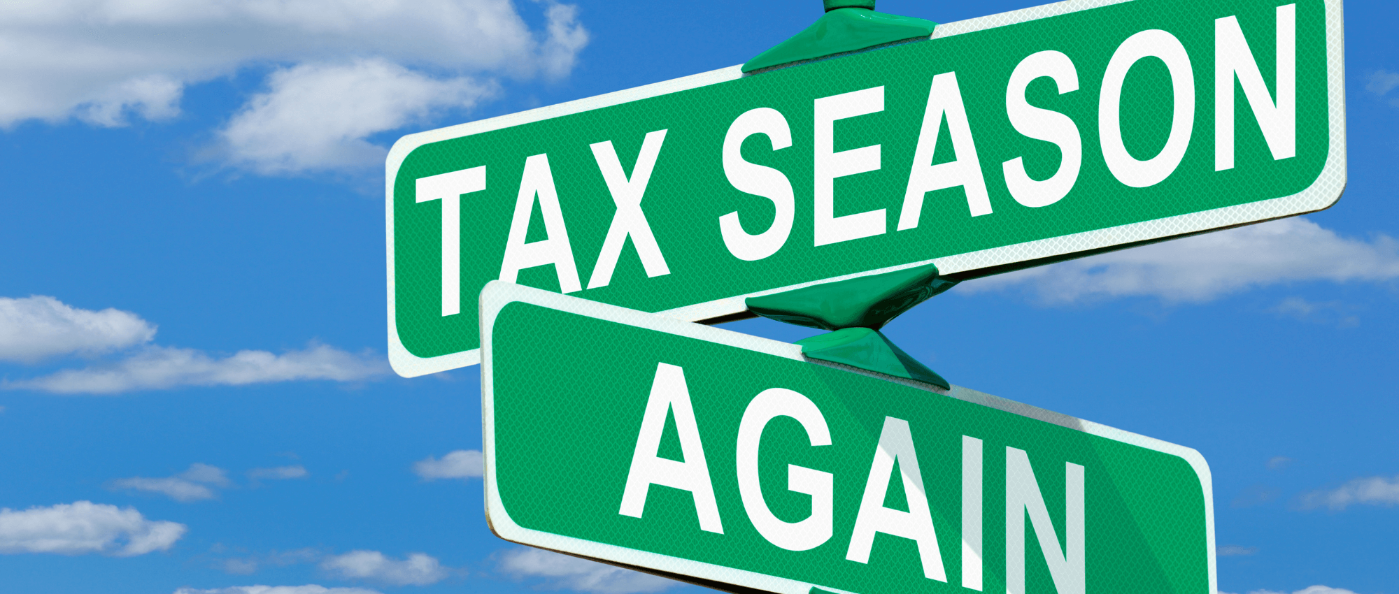road sign reading tax season again