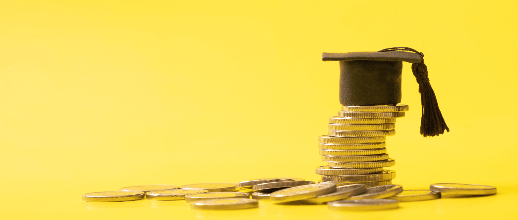Coins and a graduation cap