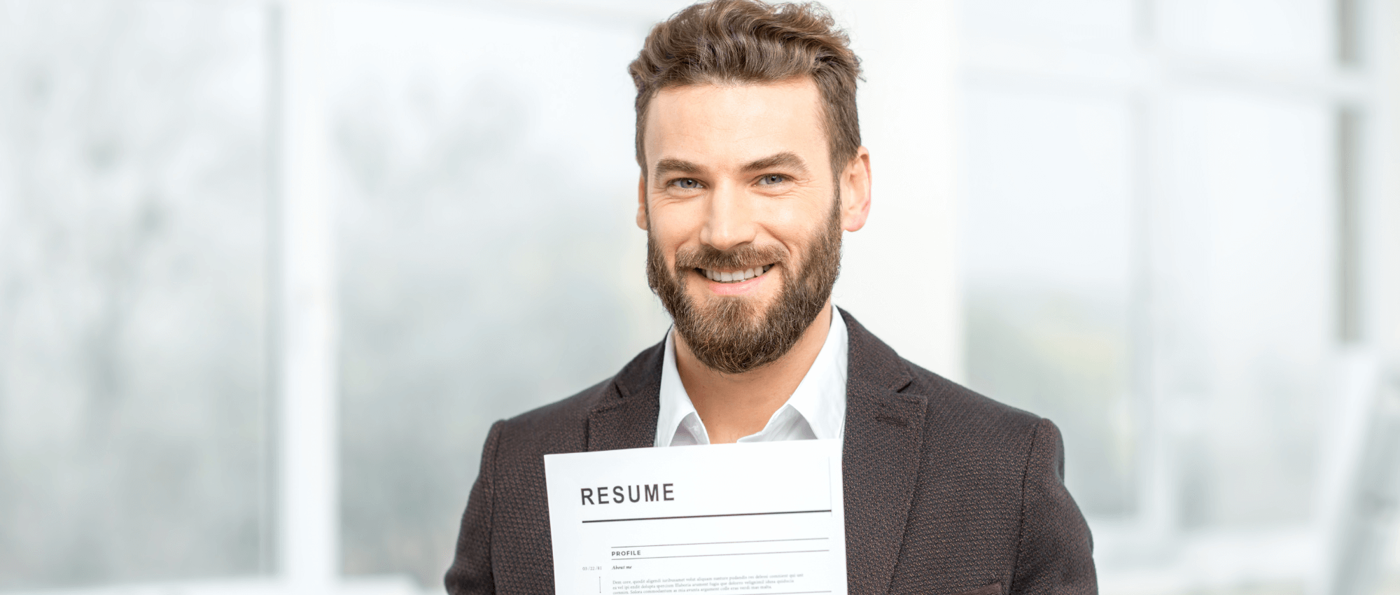 A man holding his resume