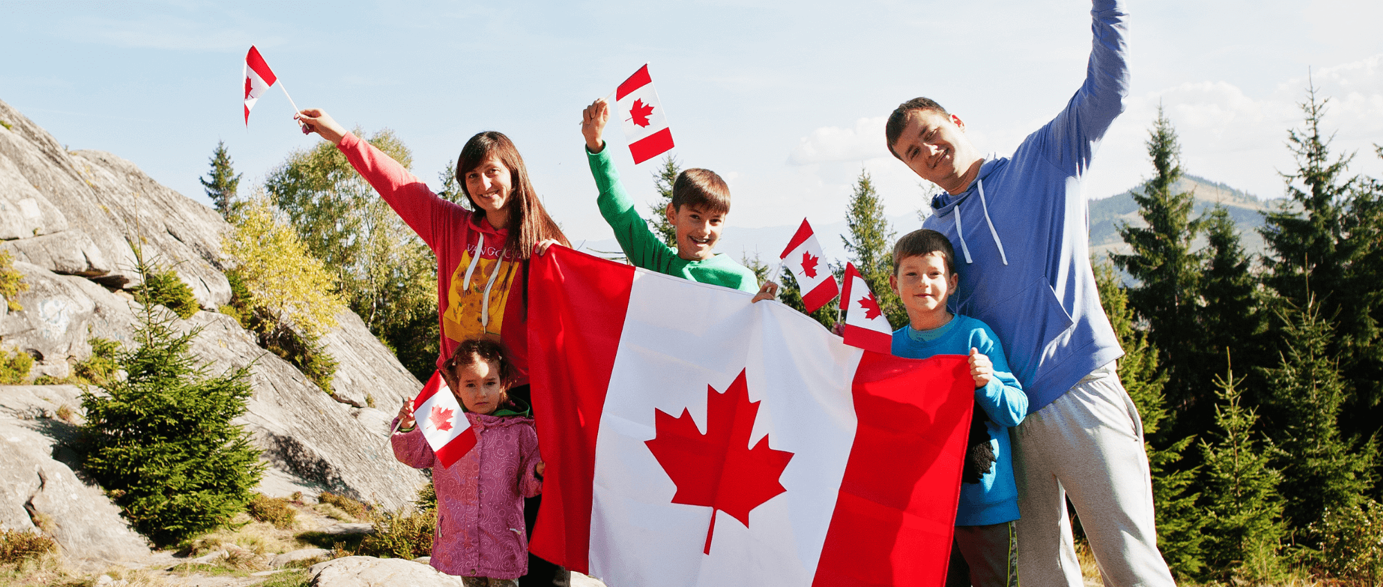 A family holding the Canadian flag