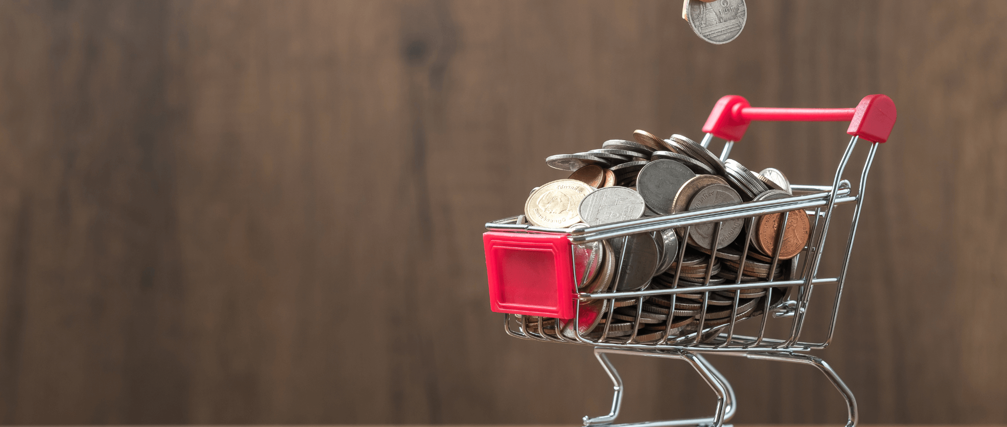 shopping cart full of coins