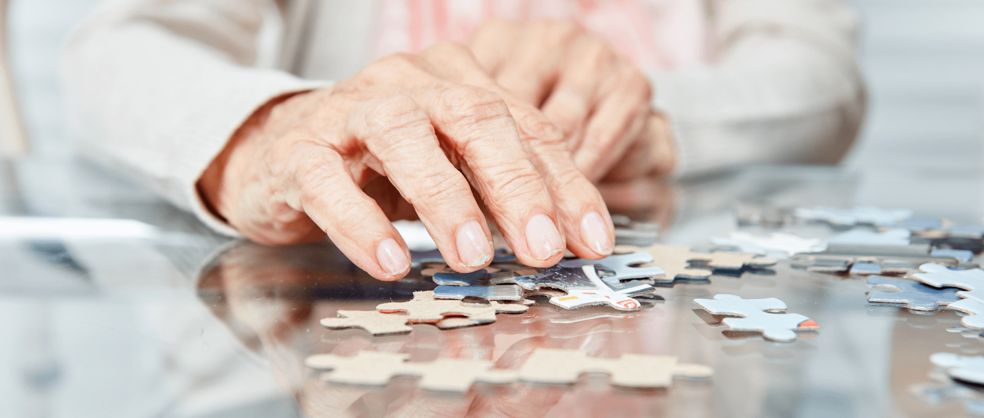 A senior playing puzzle
