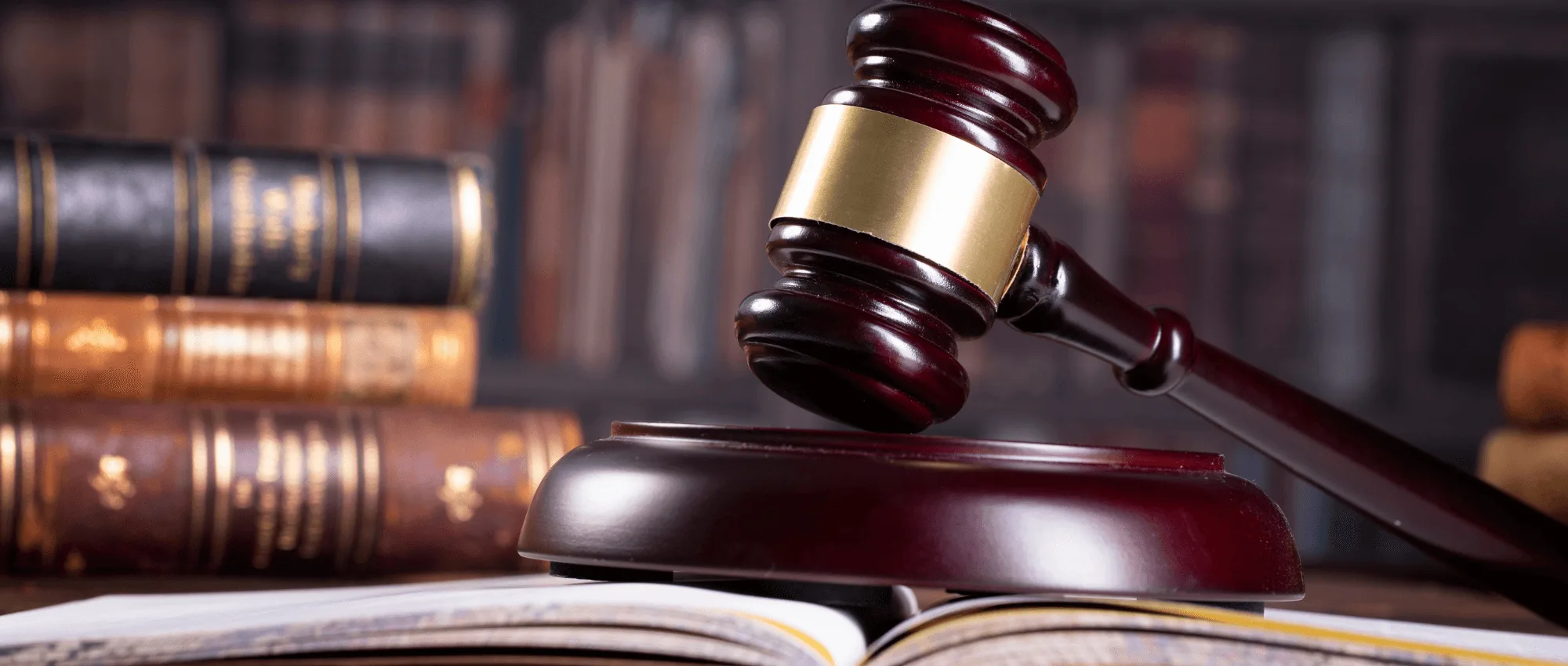 A judge hammer on an open book