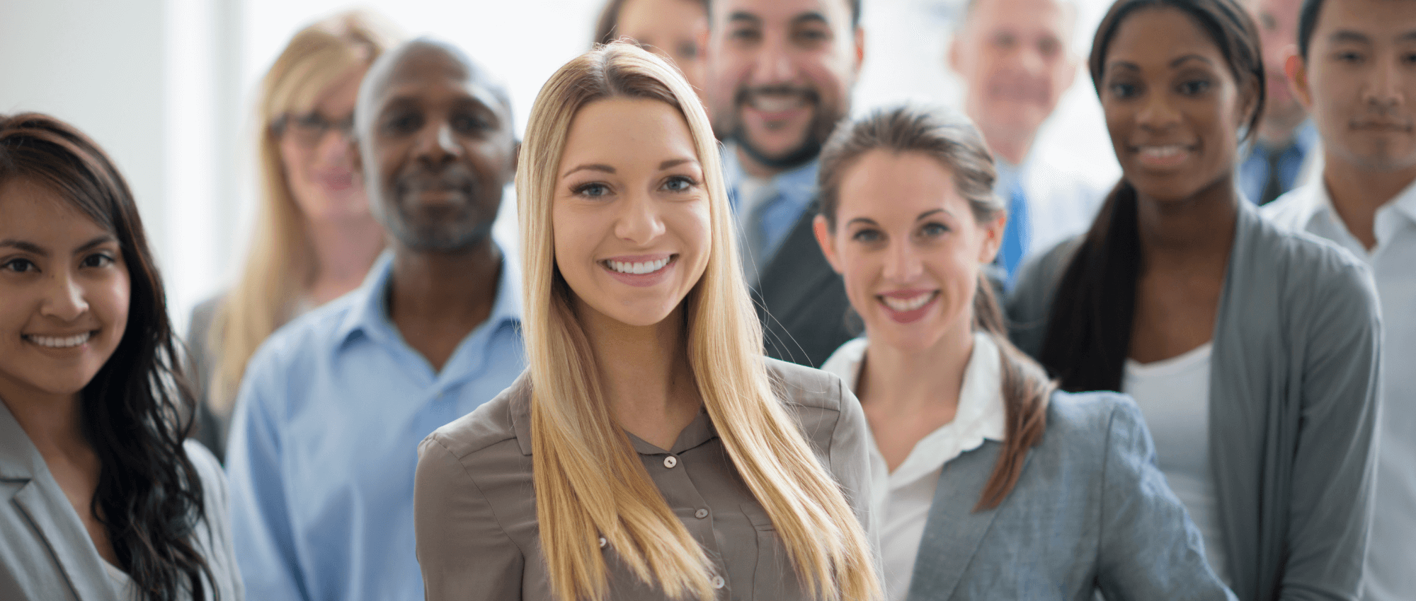 Diverse working professionals smiling to the camera