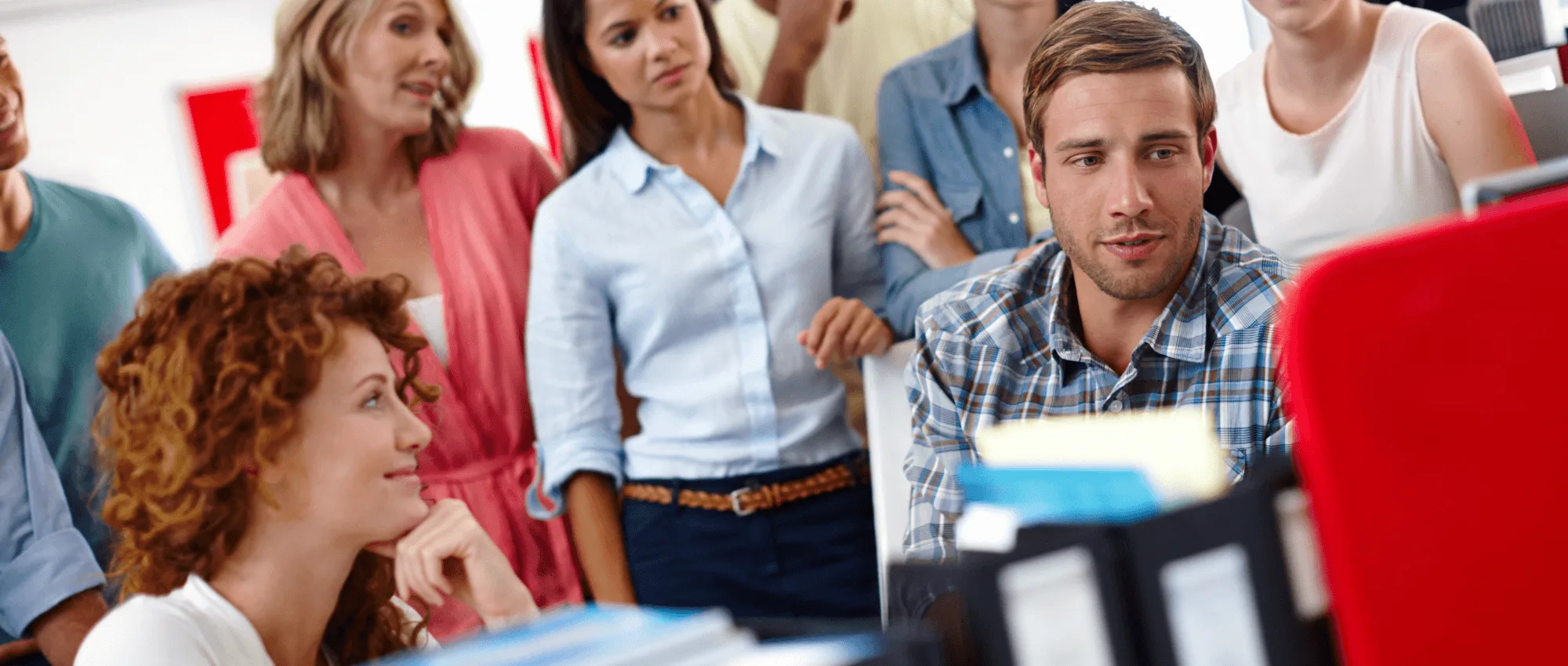 A person with his wife speaking to a customer service representative