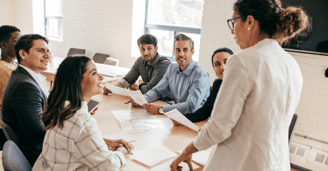 employees in the workplace listening to presentation